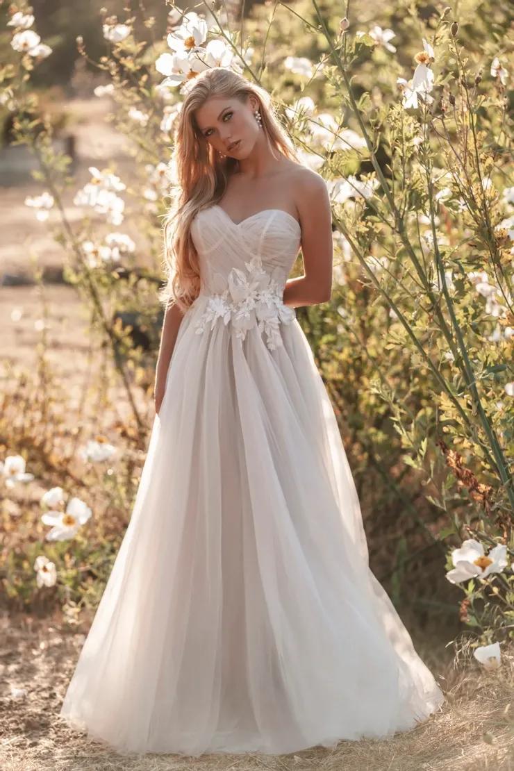 Model wearing a white Allure romance gown